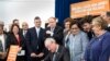 In this photo provided by the New Jersey Governor's Office, Gov. Phil Murphy, center, signs several gun safety bills at the Richard J. Hughes Justice Complex Atrium in Trenton, N.J., June 13 , 2018. 