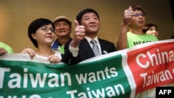 台灣衛生福利部部長陳時中（中）率團到日內瓦在世界衛生大會的場外發聲。 （2018年5月21日）