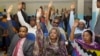 FILE - Somalia lawmakers raise their hands during a confidence vote on Prime Minister Abdiweli Sheikh Ahmed, at the Parliament Building in Mogadishu, Somalia.