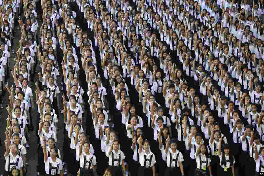 Students from St. Scholastica's College, an all-girls' school, dance in a global kickoff campaign for One Billion Rising, Manila, Philippines, Feb. 14, 2013.
