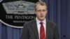 Pentagon Press Secretary George Little gestures during a news conference, December 22, 2011. 