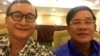 A widely shared photo on Cambodian social media, Cambodian opposition leader Sam Rainsy and Prime Minister Hun Sen take a selfie to affirm their 'culture of dialogue' at a dinner between the two families at Cambodiana Hotel in Phnom Penh, Sunday, July 12, 2015. (Courtesy of Sam Rainsy) 