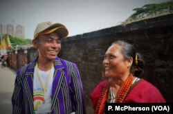 Gabriella Bousein, right, and Raymond Mon Ki, who came from far-flung Chin state for the papal mass in Yangon on Wednesday.