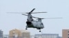图为美国海军陆战队CH-46E直升机从日本冲绳县宜野湾的普天间基地起飞资料照