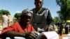 FILE - A woman casts her vote in a Malawian general election in Machinga district, north of the commercial capital, Blantyre.