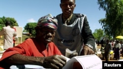 FILE - A woman casts her vote in a Malawian general election in Machinga district, north of the commercial capital, Blantyre.