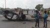 FILE - A burnt out vehicle lays on its roof in Lusaka, Zambia, April 7, 2016. On Wednesday police arrested more than 250 people for allegedly attacking foreign nationals and looting their stores.
