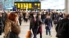 A man wears a protective face mask at Waterloo station in London, March 6, 2020. The British government has been running a massive public information campaign to try to retard the spread of the coronavirus.