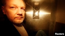 WikiLeaks founder Julian Assange leaves Southwark Crown Court after being sentenced in London, Britain, May 1, 2019. 