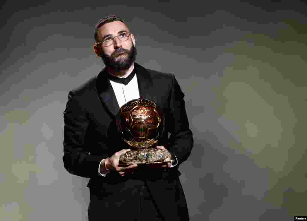 Real Madrid's French forward Karim Benzema reacts after winning the Ballon d'Or award during the 2022 Ballon d'Or France Football award ceremony at the Theatre du Chatelet in Paris, France, Oct.17, 2022.