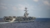 一架F/A-18F超级大黄蜂战机从美国海军“西奥多·罗斯福号”航空母舰的甲板起飞。(2020年3月18日)