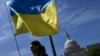 Activists wave the Ukrainian flag outside the US Capitol in Washington, DC, on April 23, 2024.