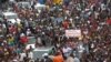 Protesters gather as thousands rally to call for the departure of South African company Waymark, which was hired by the Guinean government to re-do the country's electoral list, in Conakry, Guinea, September 20, 2012.