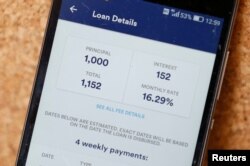 Tala app, an online financial micro lending platform, is seen on a mobile phone in this photo illustration, May 23, 2018.