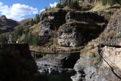 Members of the Huinchiri community rebuild an Incan hanging bridge using traditional weaving techniques in Canas, Peru, June 13, 2021. Cusco Regional Government/Handout via REUTERS