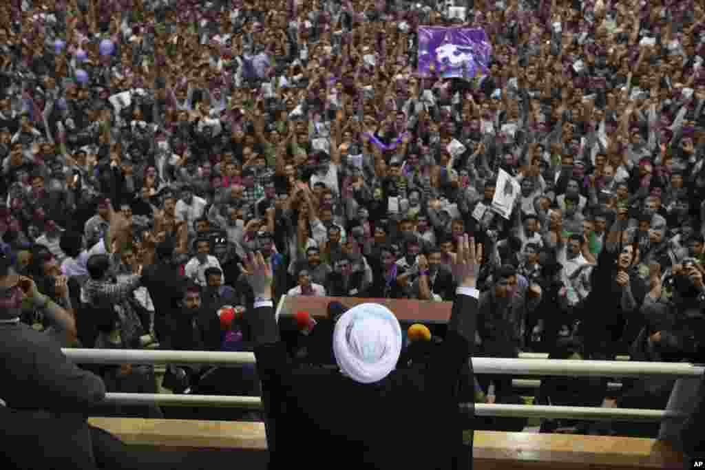 Iranian presidential candidate Hasan Rowhani waves to his supporters during his speech in a campaign rally, Oroumieh, Iran, June 10, 2013.