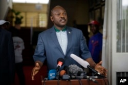 FILE - President Pierre Nkurunziza speaks at the presidential palace in Bujumbura, Burundi, May 17, 2015.