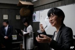 Nami Goto, managing director of Research and Development for the Brewing Society of Japan, speaks during a media tour at Ozawa Sake Brewery in Ome, on the western outskirts of Tokyo, Japan, Wednesday, Nov. 13, 2024. (AP Photo/Hiro Komae)