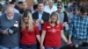 FILE - Mourners bow their heads in prayer during a vigil held after a shooting left several people dead at Santa Fe High School in Santa Fe, Texas.