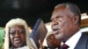 Zambia's new President Michael Sata, right, takes the oath of office on the steps of the supreme court in Lusaka, September 23, 2011.