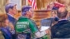This courtroom sketch depicts former Trump campaign chairman Paul Manafort, center in a wheelchair, during his sentencing hearing in federal court before Judge T.S. Ellis III in Alexandria, Va., March 7, 2019.