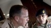 Gen. Ashfaq Parvez Kayani, Pakistani chief of Army Staff points out a feature to Navy Adm. Mike Mullen, chairman of the Joint Chiefs of Staff during an aerial tour of Northern Pakistan, 24 Jul 2010
