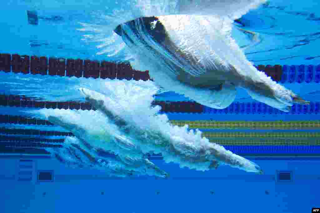 Swimmers dive in the Men's Swimming 100m Breaststroke event during the Baku 2017 4th Islamic Solidarity Games at the Baku Aquatic Center, Azerbaijan.