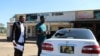 Opponents smashed windows of cars belonging to organizers of Malawi election protests, in Blantyre, July 5, 2019. (L. Masina/VOA)