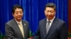 国际媒体看习近平与安倍尴尬握手