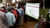 FILE - Kenyan voters line up to cast their votes in the Kibera slum, Nairobi, Kenya.