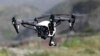 FILE - The Inspire 1, a drone manufactured by DJI, is flown in Davenport, Calif., March 10, 2015. 