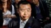 FILE - Human rights activist Jiang Tianyong speaks to journalists in Beijing, China, May 2, 2012. Jiang detained in connection with a sweeping crackdown on lawyers and activists stood trial Aug. 22, 2017, on charges of subversion of state power.