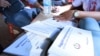 Test cards and books are used by health agents to conduct blood test for HIV on residents in Peam village, Kandal province, on Monday, Feb 22, 2016. (Photo: Aun Chhengpor/VOA Khmer)