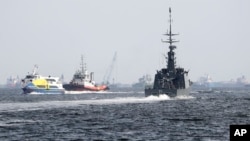 The Republic of Singapore Navy's RSS Brave, right, sails off from the Tuas naval base on a search-and-rescue mission for the USS John S. McCain's missing sailors, Aug. 24, 2017, in Singapore. Aircraft and ships from the navies of Singapore, Malaysia, Indonesia and Australia are searching seas east of Singapore where the collision between the USS John S. McCain and an oil tanker happened Monday.