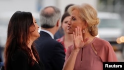Stephanie Grisham, spokesperson for first lady Melania Trump, reacts with White House senior advisor Kellyanne Conway (R) after arriving for a campaign rally with U.S. President Donald Trump in Orlando, Florida, U.S., June 18, 2019.