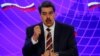 El presidente de Venezuela, Nicolás Maduro, habla junto al viceprimer ministro ruso, Yury Borisov, después de firmar documentos de un acuerdo bilateral en el Palacio de Miraflores durante su visita a Caracas, el 16 de febrero de 2022. 