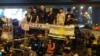 羅冠聰(左二)在雨傘運動滿月紀念大會上（美國之音海彥拍攝）