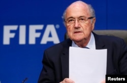 FILE - Re-elected FIFA President Sepp Blatter arrives for a news conference after an extraordinary Executive Committee meeting in Zurich, Switzerland, May 30, 2015.