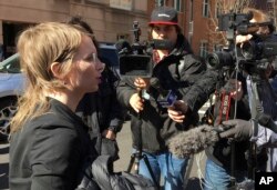 FILE - Chelsea Manning addresses the media outside federal court in Alexandria, Va., March 5, 2019. The former Army intelligence analyst was ordered to jail on March 8, 2019 for refusing to testify to a Virginia grand jury investigating WikiLeaks.