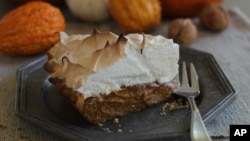 FILE - This photo shows citrus pumpkin meringue pie in Concord, New Hampshire, October 12, 2015. (AP Photo/Matthew Mead)