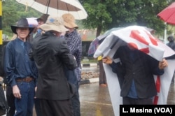 Protesters braved the rain in their bid to seek a solution aiming to end attacks on albinos in Malawi.