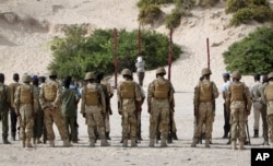 Hassan Hanafi Haji is tied to a wooden post as he is prepared to be executed by firing squad at a police academy in the capital Mogadishu, Somalia, April 11, 2016.