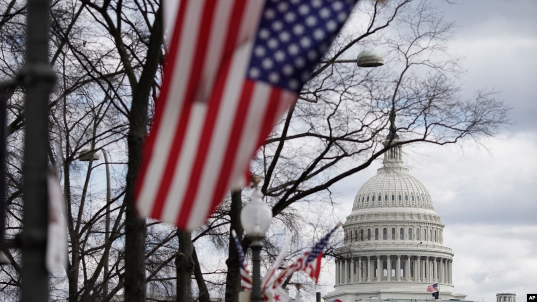 Flags are in place near the Capitol ahead of the inauguration of President-elect Joe Biden and Vice President-elect Kamala Harris, in Washington, Jan. 17, 2021. 