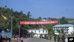 Soldiers of the ethnic Kachin Independence Army (KIA) patrol in downtown Laiza, northeastern Burma, January 4, 2013. 