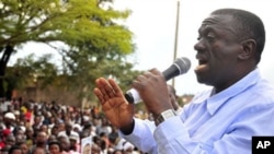 Uganda's main opposition leader, Dr. Kiiza Besigye, addresses his supporters at Masaka Lyantonde, about 200 kms west of Kampala capital Uganda. Saturday, Nov. 6, 2010
