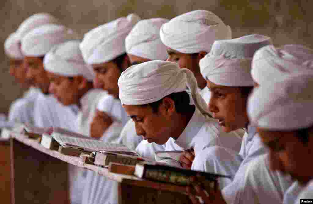 Boys read the Koran inside Markaz Al-Madrasa Al-Islamia, an Islamic seminary and orphanage, during the Muslim fasting month of Ramadan in Shadipora on the outskirts of Srinagar, India.