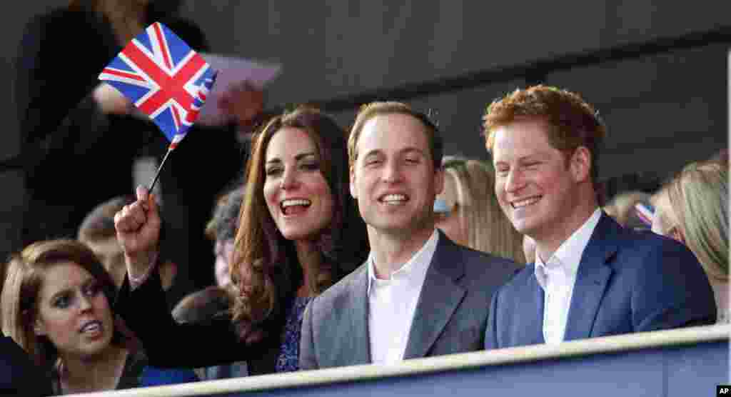 The Duke and Duchess of Cambridge with Prince Harry, right, attend the Diamond Jubilee concert, June 4, 2012.