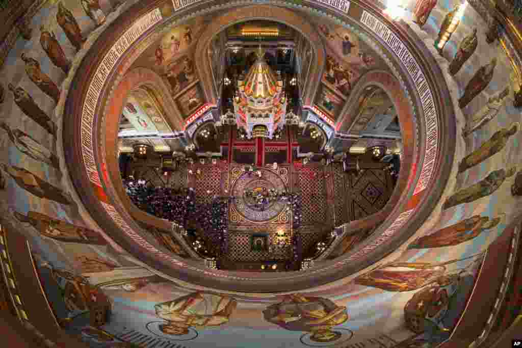 Russian Orthodox believers line up to kiss the relics of Saint Nicholas, center, in the Christ the Savior Cathedral in Moscow, Russia. Relics of Saint Nicholas, one of the Russian Orthodox Church's most revered figures, arrived in Moscow from an Italian church where they have lain for 930 years.