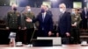 NATO Secretary General Jens Stoltenberg, center, and Russia's Deputy Foreign Minister Alexander Grushko, fourth right, arrive for the NATO-Russia Council at NATO headquarters, in Brussels, Jan. 12, 2022. 