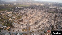FILE - An aerial view of properties destroyed by the Tubbs Fire is seen in Santa Rosa, California, Oct. 11, 2017. 